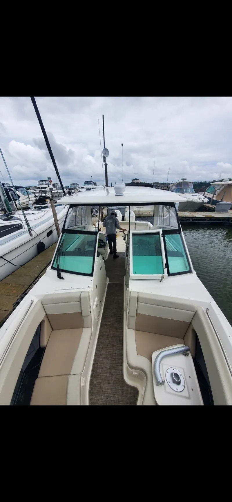 Slide: The Image of Boston Whaler 28 Vantage 2025 docked, modern design. - 24