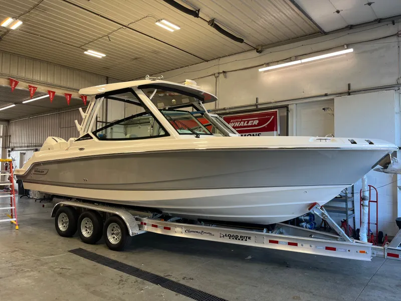 Slide: The Image of Boston Whaler 28 Vantage 2025 on trailer in workshop. - 29