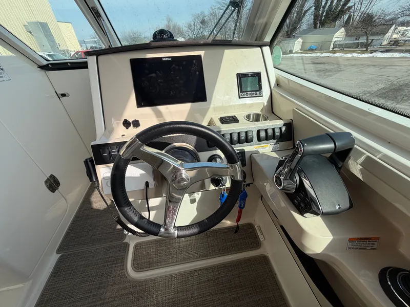 Slide: The Image of Interior view of 2025 Boston Whaler 28 Vantage cockpit. - 7