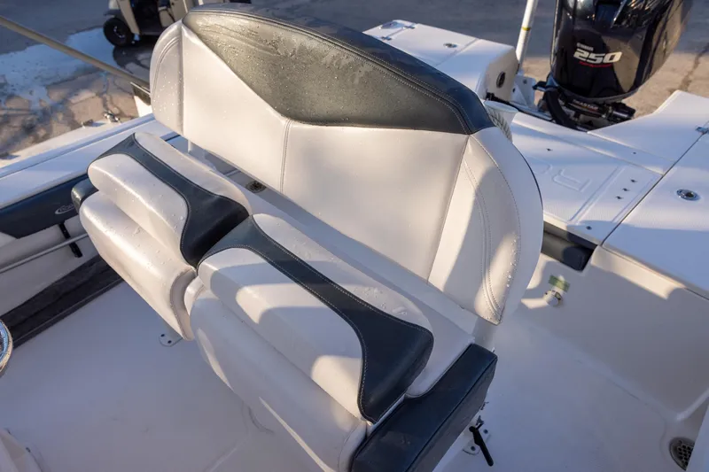 Slide: The Image of 2021 Robalo 226 Cayman boat seating with dual-tone upholstery and Yamaha 250 outboard motor. - 11