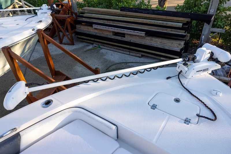 Slide: The Image of 2021 Robalo 226 Cayman boat with Minn Kota trolling motor on deck. - 14