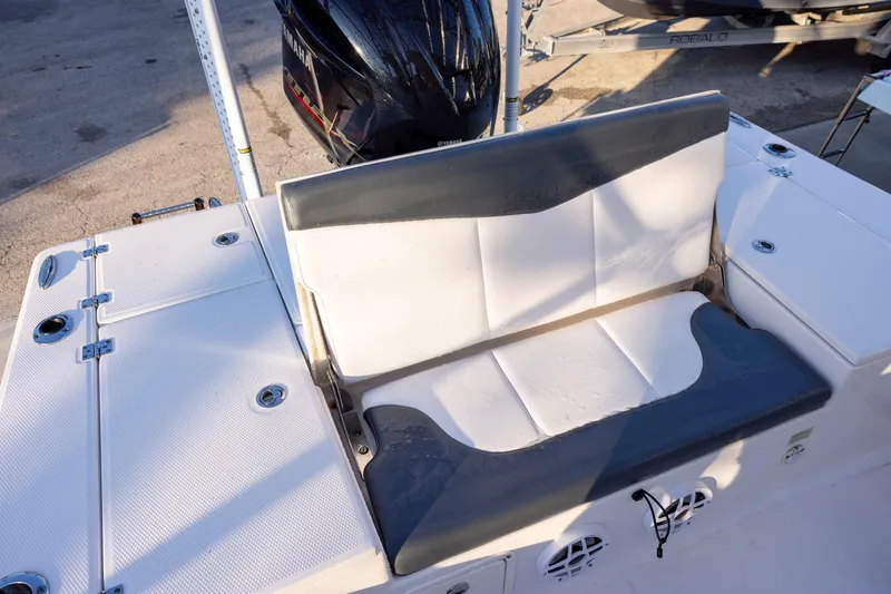 Slide: The Image of 2021 Robalo 226 Cayman boat seat with Yamaha engine in background. - 6