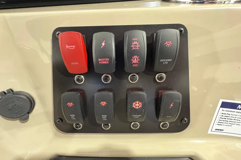 Slide: The Image of Control panel of 2025 Crest Classic 220 boat with labeled switches. - 19