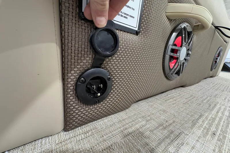 Slide: The Image of 2025 Crest Classic 220 boat interior with speaker and power outlet detail. - 23