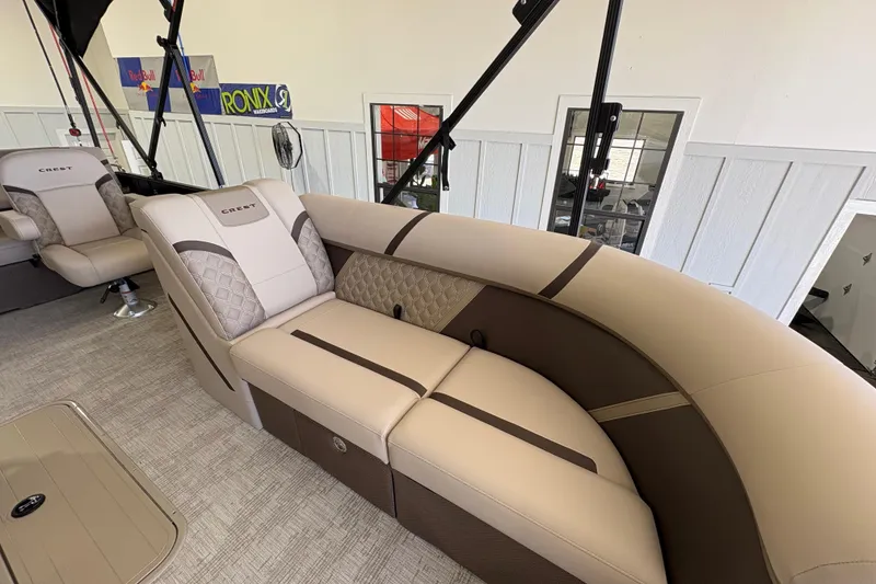 Slide: The Image of Luxurious interior of 2025 Crest Classic 220 pontoon boat with plush seating. - 28