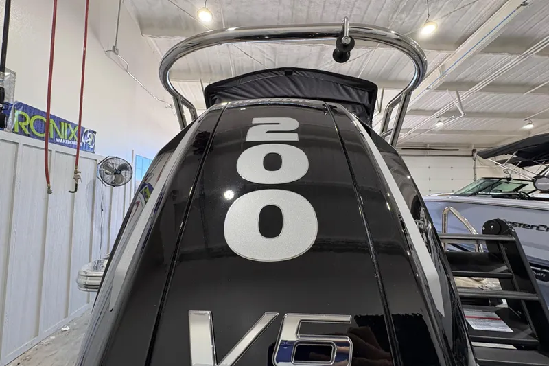 Slide: The Image of 2025 Crest Classic 220 boat with V6 engine, displayed indoors. - 5