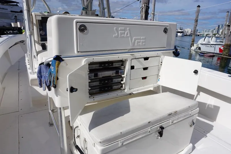Slide: The Image of 2006 SeaVee 340i Open boat with open storage compartments and gloves, docked at marina. - 8