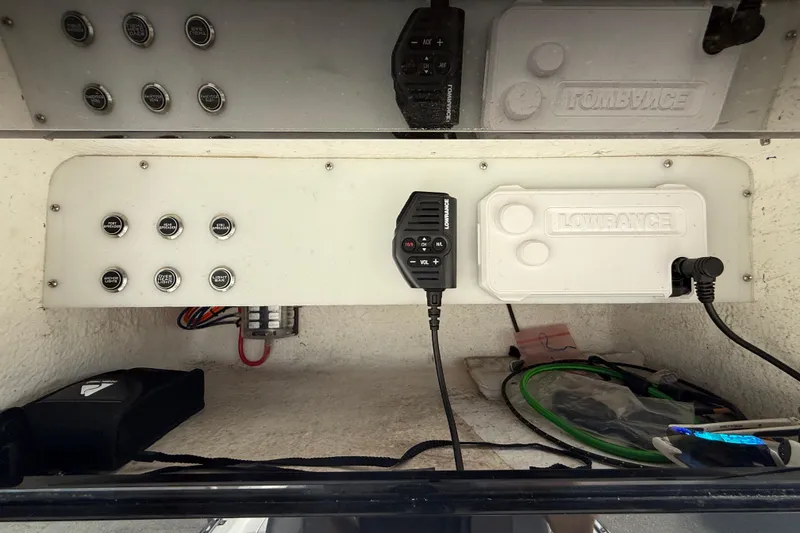 Slide: The Image of Control panel of a 2009 BlackJack 224 boat with Lowrance equipment. - 18