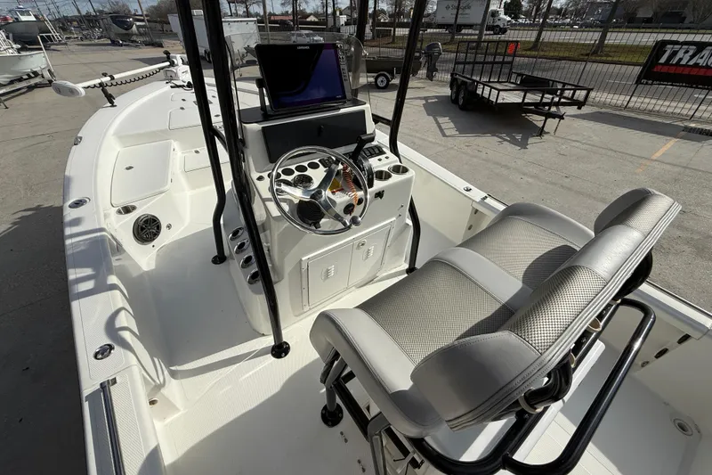 Slide: The Image of 2009 BlackJack 224 boat interior with steering console and seating. - 9