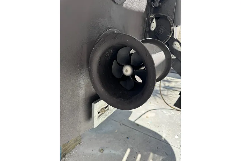 Slide: The Image of 2013 Cabo 44 Hardtop Express boat thruster detail in close-up view. - 106