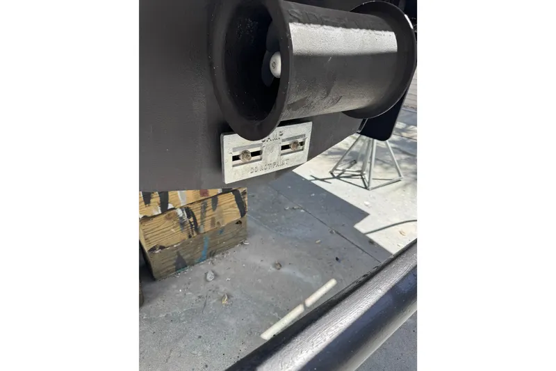 Slide: The Image of 2013 Cabo 44 Hardtop Express boat detail showing propeller and hull components. - 107