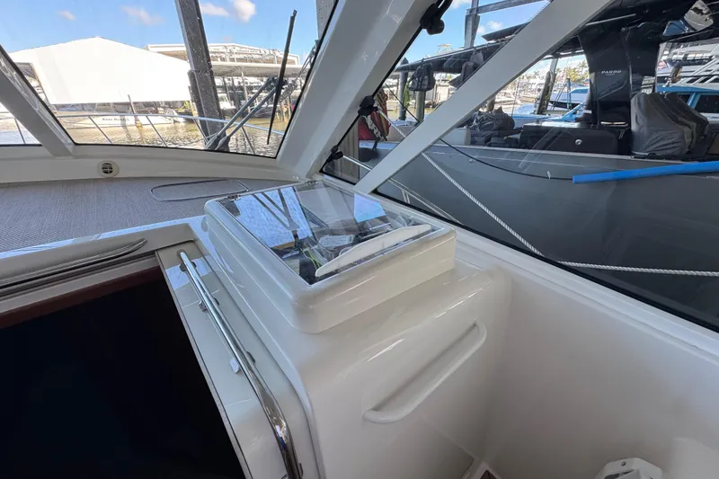 Slide: The Image of 2013 Cabo 44 Hardtop Express interior with sleek design and modern controls. - 47