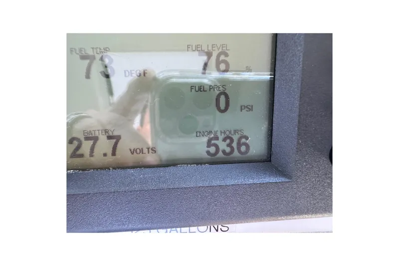 Slide: The Image of Display panel of 2013 Cabo 44 Hardtop Express showing fuel and engine metrics. - 53