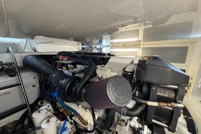 Slide: The Image of Engine room of 2013 Cabo 44 Hardtop Express, showcasing detailed mechanical components. - 77