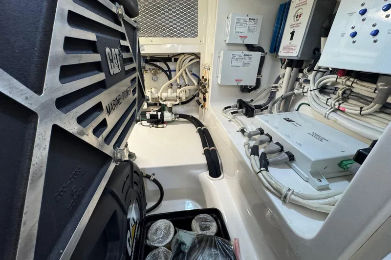 Slide: The Image of Engine room of 2013 Cabo 44 Hardtop Express with CAT marine power system. - 83