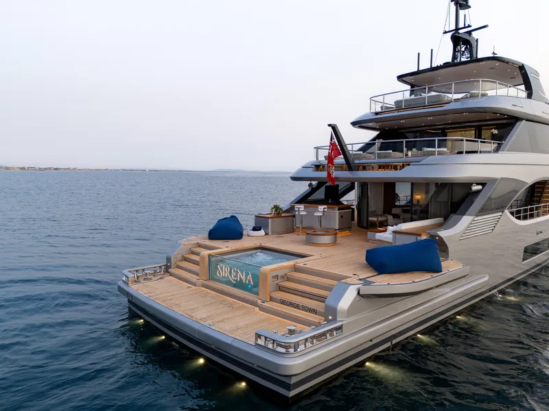 Slide: The Image of Luxurious 2024 Benetti Oasis 34M yacht with elegant deck and pool, cruising on serene waters. - 2