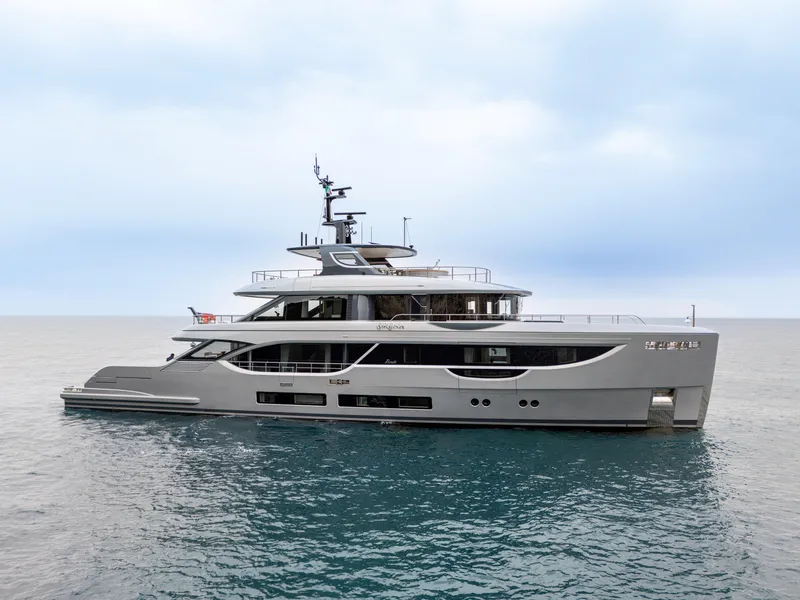 Slide: The Image of 2024 Benetti Oasis 34M Co Ownership yacht on calm sea under cloudy sky. - 10