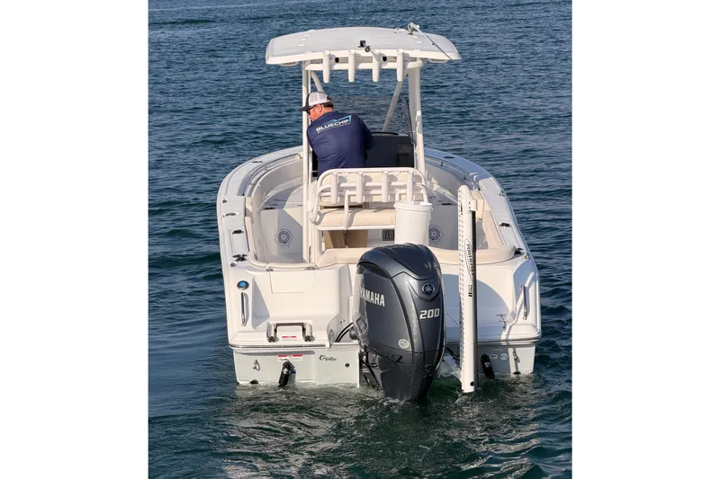Slide: The Image of 2025 Sea Hunt Ultra 229 boat with Yamaha 200 engine on water. - 13