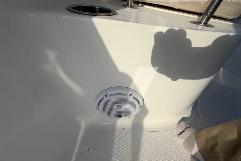 Slide: The Image of Interior of 2025 Sea Hunt Ultra 229 boat, featuring speaker and cup holder. - 19