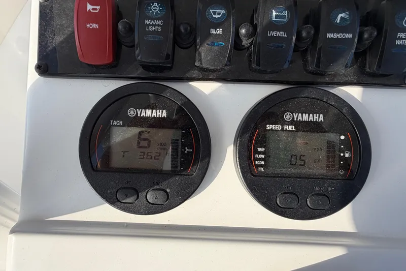 Slide: The Image of Yamaha gauges on 2025 Sea Hunt Ultra 229 boat dashboard, showing tachometer and speed fuel indicators. - 26