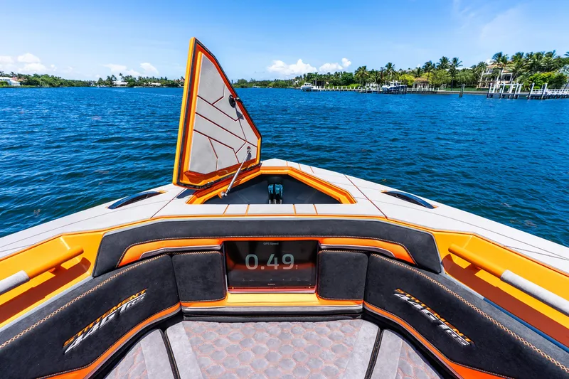 Slide: The Image of Luxury Statement 44 GRTS boat interior with vibrant orange accents, cruising on a sunny day, 2025 model. - 30