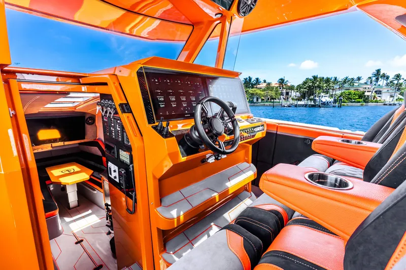 Slide: The Image of Luxurious 2025 Statement 44 GRTS boat interior with vibrant orange accents and advanced navigation system. - 37