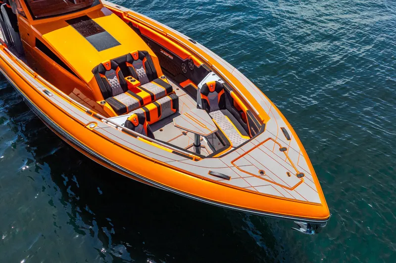 Slide: The Image of Orange 2025 Statement 44 GRTS speedboat with sleek design and luxurious seating on water. - 10