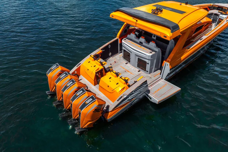 Slide: The Image of 2025 Statement 44 GRTS boat with quad outboard engines on water. - 12