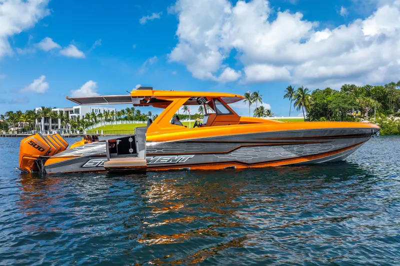 Slide: The Image of Orange 2025 Statement 44 GRTS boat on water, sunny day, palm trees in background. - 14