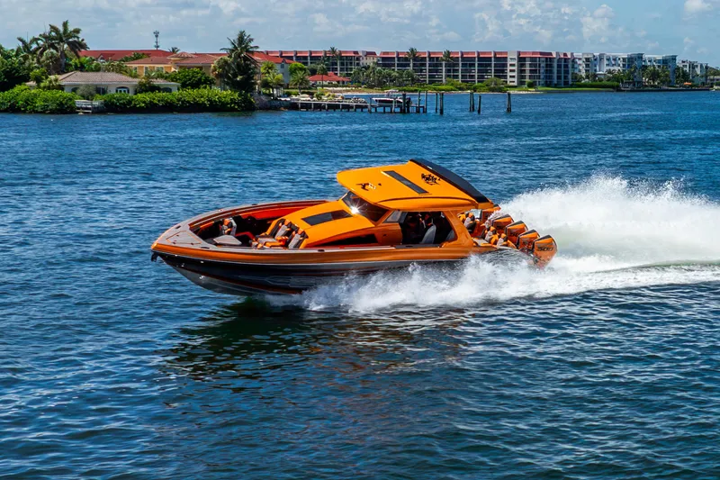 Slide: The Image of Orange 2025 Statement 44 GRTS speedboat cruising on a sunny day. - 16
