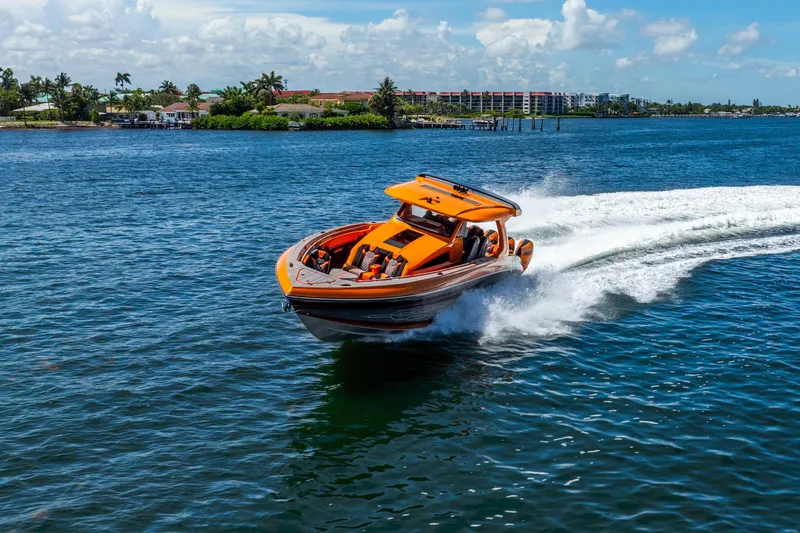Slide: The Image of Orange 2025 Statement 44 GRTS speedboat cruising on a sunny day. - 17