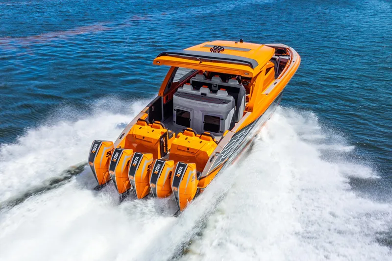 Slide: The Image of 2025 Statement 44 GRTS boat with quad outboard engines cruising on water. - 21