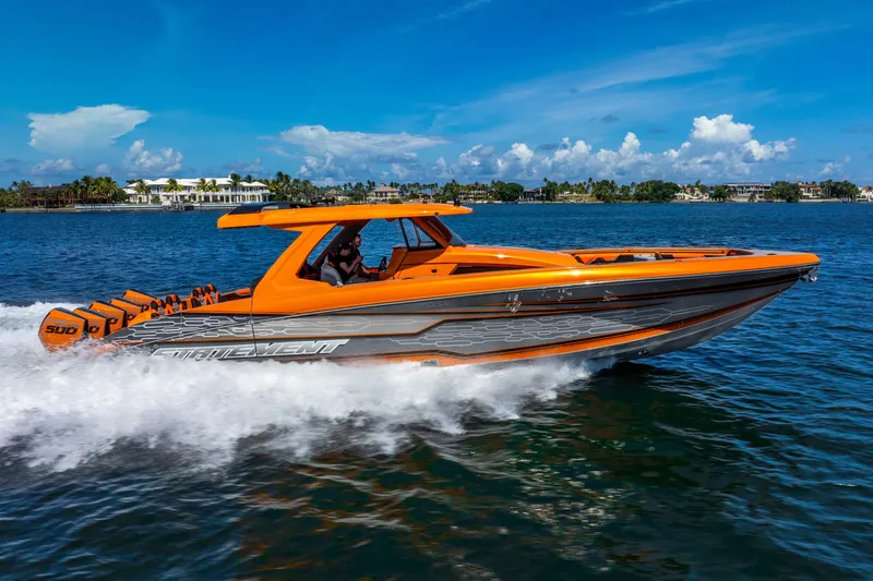 Slide: The Image of 2025 Statement 44 GRTS speedboat cruising on a sunny day, vibrant orange design. - 24