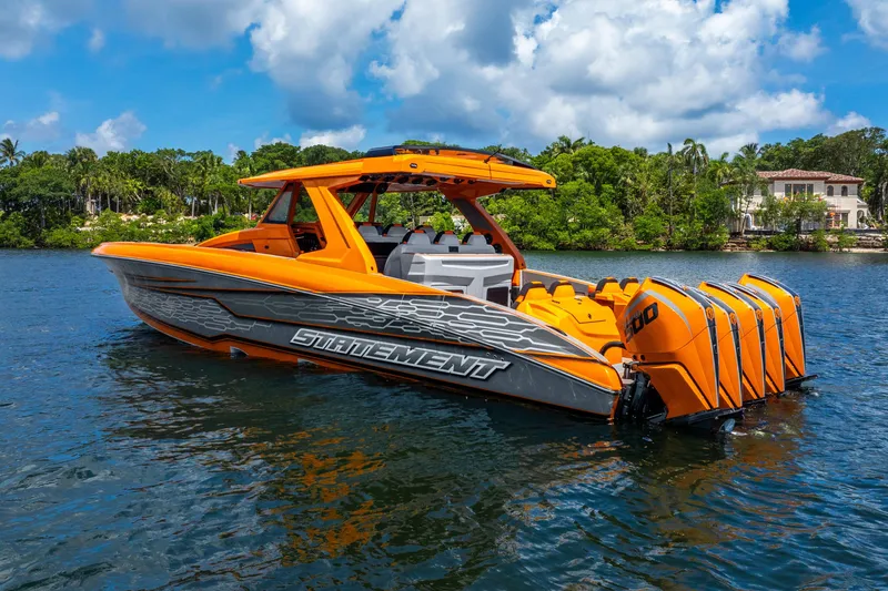 Slide: The Image of Orange 2025 Statement 44 GRTS boat with multiple engines on a sunny day. - 3