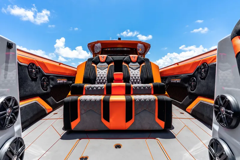 Slide: The Image of Luxury interior of 2025 Statement 44 GRTS boat with orange and black seating. - 31