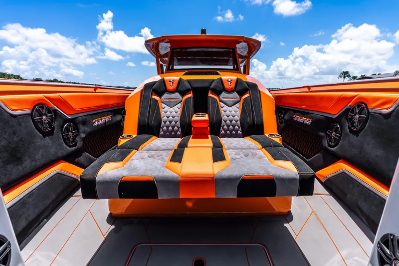 Slide: The Image of Luxury interior of 2025 Statement 44 GRTS boat with vibrant orange and black seating. - 33