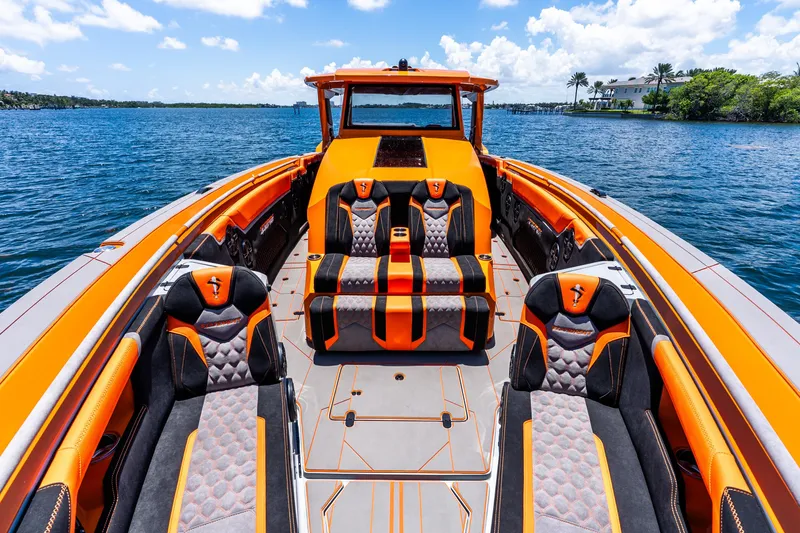 Slide: The Image of Luxury 2025 Statement 44 GRTS boat with vibrant orange and black seating on open water. - 34