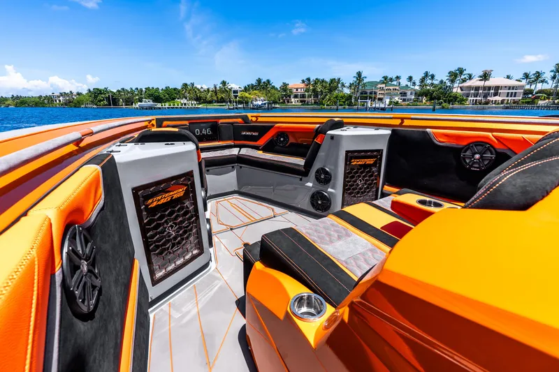 Slide: The Image of Luxurious 2025 Statement 44 GRTS boat interior with vibrant orange seating and modern design. - 36