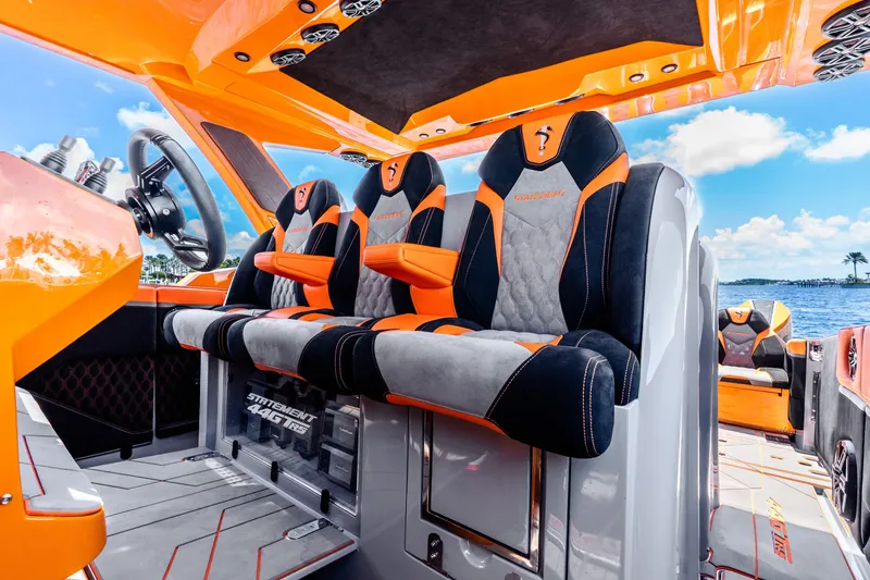 Slide: The Image of Luxurious interior of 2025 Statement 44 GRTS boat with vibrant orange and black seating. - 39