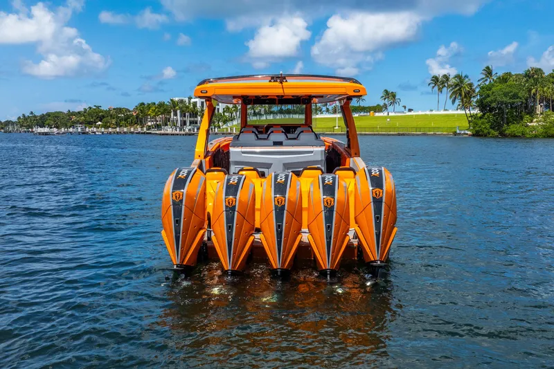 Slide: The Image of Orange 2025 Statement 44 GRTS boat with multiple engines on a sunny day. - 4