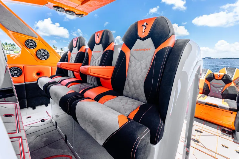 Slide: The Image of Luxurious 2025 Statement 44 GRTS boat interior with vibrant orange and black seating. - 40