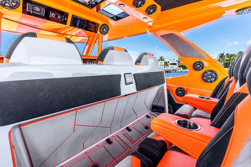 Slide: The Image of Luxurious interior of 2025 Statement 44 GRTS boat with vibrant orange accents and modern design. - 42