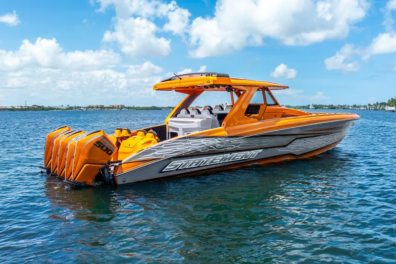 Slide: The Image of Orange 2025 Statement 44 GRTS boat with multiple engines on a sunny day. - 5