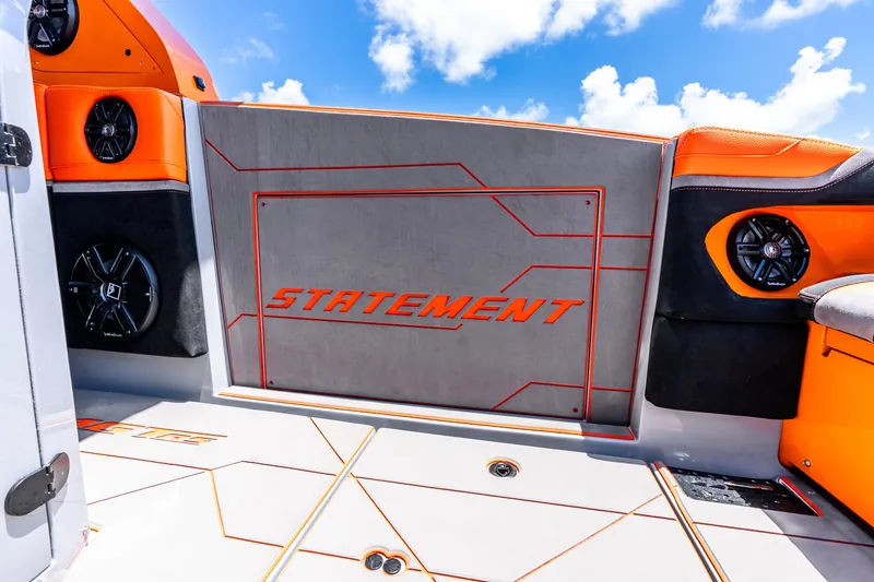 Slide: The Image of 2025 Statement 44 GRTS boat interior with orange accents and speaker system. - 56