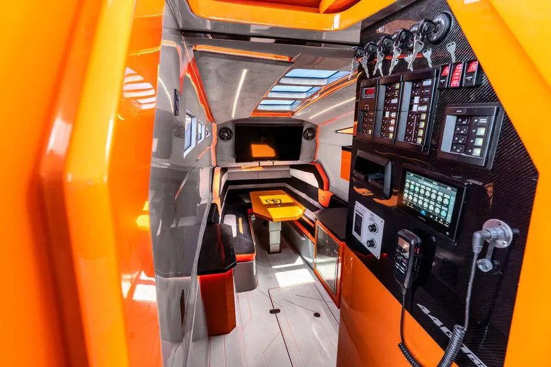 Slide: The Image of Luxurious interior of 2025 Statement 44 GRTS boat with vibrant orange accents and advanced control panels. - 60