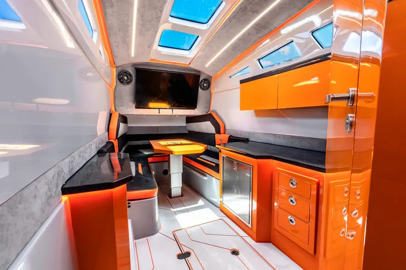 Slide: The Image of Luxurious interior of 2025 Statement 44 GRTS boat with modern orange and black design. - 61