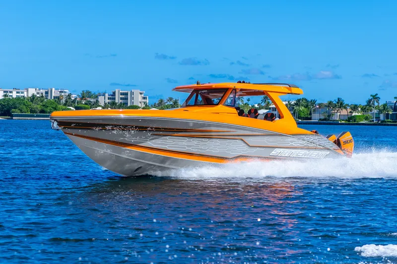 Slide: The Image of 2025 Statement 44 GRTS boat cruising on blue water under clear sky. - 68