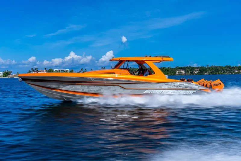 Slide: The Image of Orange 2025 Statement 44 GRTS speedboat cruising on blue water under clear skies. - 69