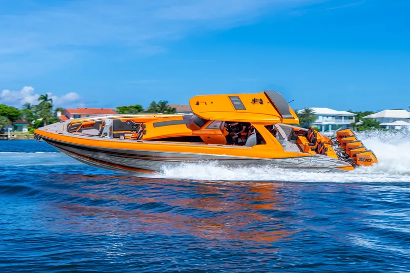 Slide: The Image of Orange 2025 Statement 44 GRTS speedboat cruising on blue water, showcasing sleek design and powerful engines. - 72