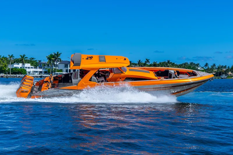 Slide: The Image of Orange Statement 44 GRTS speedboat cruising on blue water, 2025 model. - 75